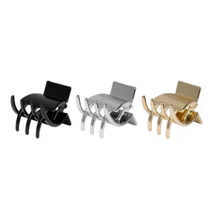 Mini metal hair claw clip set in black, gold, and silver finishes with a secure spring design