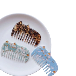 Three-piece acetate cat-shaped hair combs with wide teeth and gold facial details