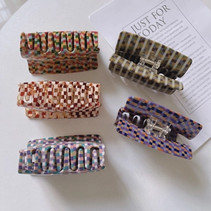 Retro checkered acetate hair claw clips set in various colorful checkerboard patterns