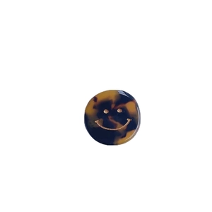 Pinza per capelli rotonda in acetato tartarugato marrone con faccina sorridente d'oro