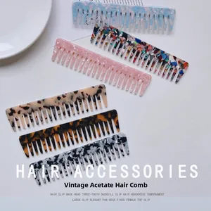 Detail view of retro acetate wide-tooth hair combs featuring marble and tortoiseshell textures