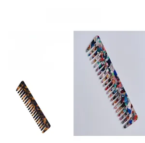 Detail of wide tooth acetate combs in tortoiseshell and colorful stone patterns