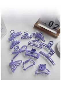 Detailed collection of purple matte hair clips in butterfly, star, and geometric shapes