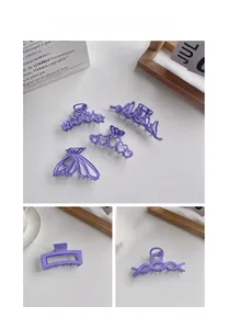 Detail of purple matte hair clips featuring star, heart, butterfly, and wave designs
