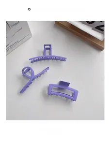 Set of three matte purple hair claws including arched and rectangular frame designs