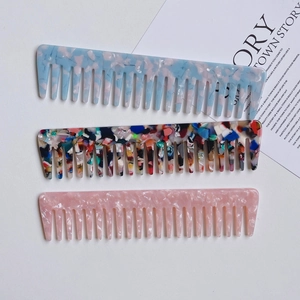 Three-piece set of wide-tooth acetate hair combs with marble and mosaic patterns