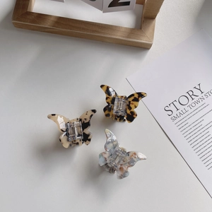 Elegant acetate butterfly hair claws with tortoiseshell and marble patterns in a 3-piece set