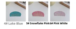 Detailed view of semi-circular acetate hair combs in lake blue, snowflake pink, and pearl white