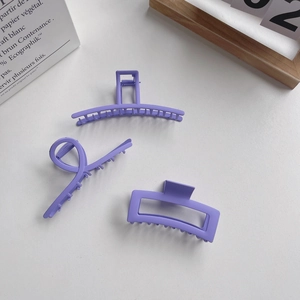Three lavender matte hair claws set including rectangle and hollow curve designs