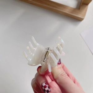 Elegant pearlescent white acetate hair claw clip with iridescent finish for women