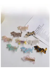 Detail showing 10 assorted acetate dachshund hair clips with rhinestones and marble patterns