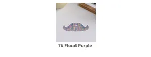 Detailed macro view of mustache-shaped acetate hair comb in floral purple marble texture