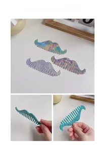 Detail of colorful acetate mustache-shaped hair combs with pearlescent and floral patterns
