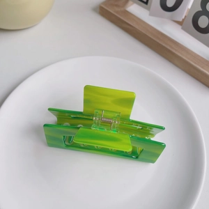 Elegant rectangle acetate claw clip with green marble pattern and golden spring