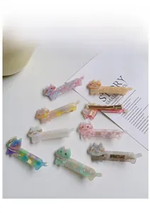 Detail view of acetate cat hair clips in eight colors with pearl and rhinestone accents