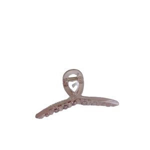 Elegant dusty pink translucent hair claw clip with large twist design on white background