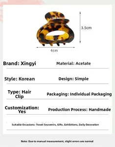 Detail view of tortoiseshell hair claw clip with 4cm by 3.5cm size specifications