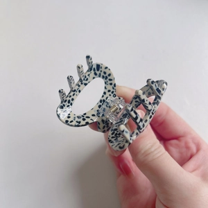 French vintage acetate hair claw clip with black and white dalmatian pattern