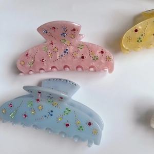 Floral acetate hair claws with sparkling rhinestones in multi-color pastel marble finish