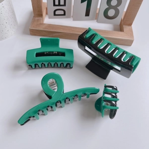 Green and black acetate hair claw clip set in various shapes for women's hair styling