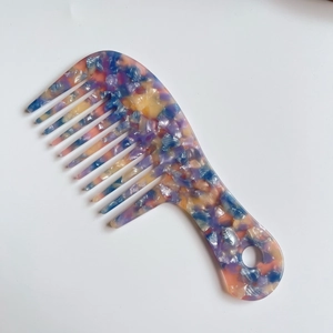 Artistic marble textured acetate wide tooth hair comb with elegant swirling patterns