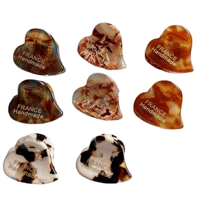 Mini heart acetate hair clips set in tortoiseshell and marble patterns with gold label