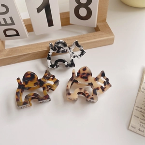 Elephant shaped acetate hair claws in tortoise shell and black white patterns