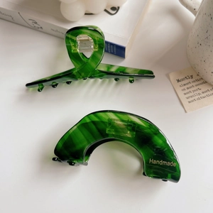 Green acetate marble shark hair clips with golden Handmade label for elegant hairstyling