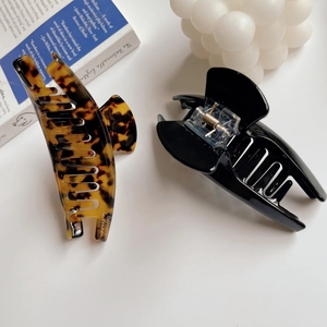 Elegant large French acetate hair claw clips in tortoise shell and black finish