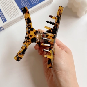 Detail shot of large leopard tortoise shell hair claw clip with strong metal spring