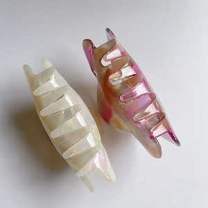 Set of two elegant acetate hair claws with iridescent pearl white and marble finish