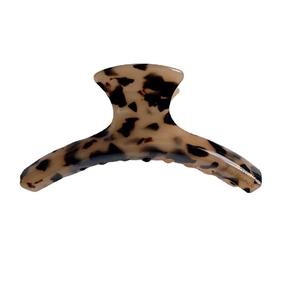 Elegant tortoiseshell acetate hair claw clip with golden la France text on white background