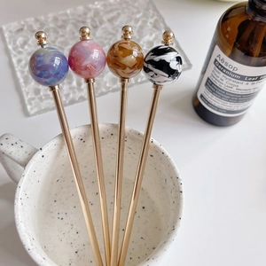 Elegant tortoise shell patterned hair pins with colorful marble spheres and gold-plated metal rod