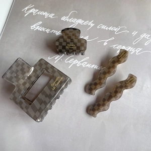 Grey checkered acetate hair claw clips and bobby pins set with golden branding