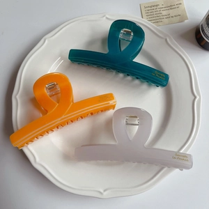 Three colorful French leopard acetate hair claws in Morandi tones for elegant styling
