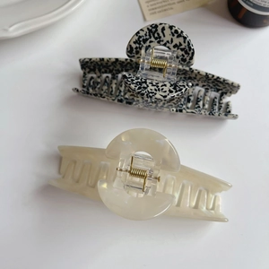 French vintage acetate hair claws in leopard print and cream pearl finish with metal spring