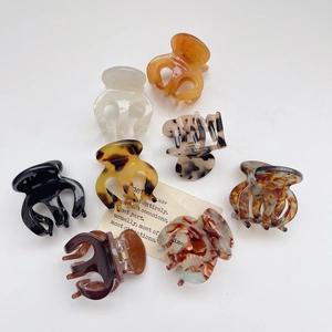 Set of 8 premium acetate small shark hair claws in marble and tortoiseshell patterns
