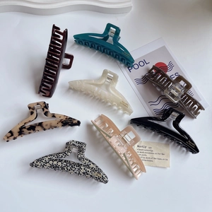 Set of 8 large acetate hair claw clips in solid colors and tortoise shell patterns