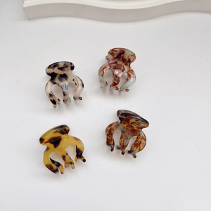 Set of 4 mini tortoiseshell acetate claw clips for hair styling in assorted colors
