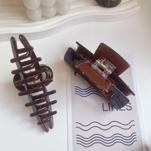 Brown acetate hair claw clips for women with glossy finish and elegant French style design