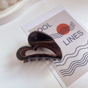 Deep coffee brown heart-shaped acetate claw clip with glossy finish and secure teeth
