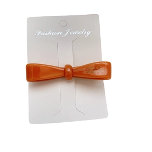 Handmade amber resin bow hair clip with France engraving on white fashion card