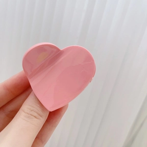 Pince à cheveux rose en forme de cœur en acétate avec une finition brillante pour filles