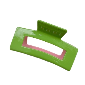 Rectangular acetate hair claw clip with candy green and pink two-tone hollow design