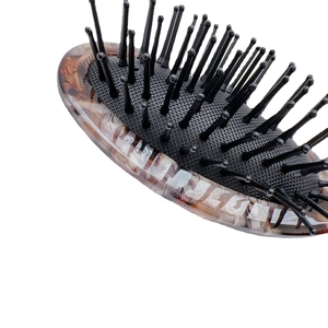Amber tortoiseshell acetate hairbrush with black air cushion and anti-static bristles