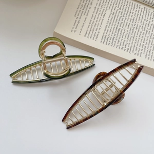 Large tortoiseshell and olive green acetate shark hair clips with golden metal frames