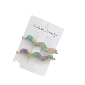 Vintage acetate wavy hair clips in gradient colors on white display card