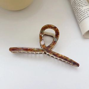 Detail of 13.5cm oversized tortoiseshell acetate hair claw with strong metal spring