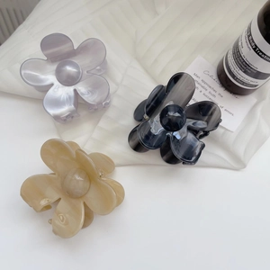 Floral acetate hair claw clips set in purple, smoky black, and beige pastel colors