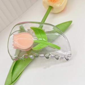 Pince à cheveux avec tulipe rose et feuilles vertes transparentes en acétate élégant